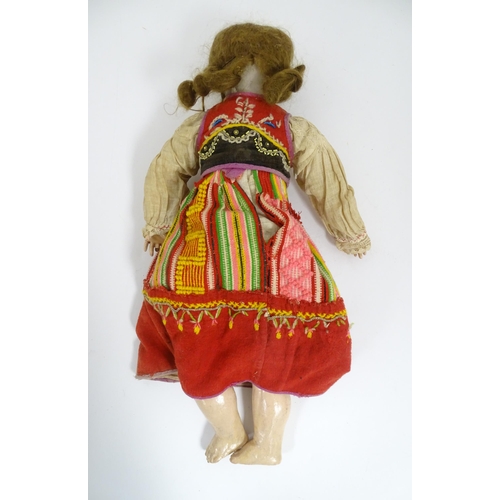 903 - Toy: A 20thC French doll with bisque head, glass eyes, painted features and a composite body with ar... 