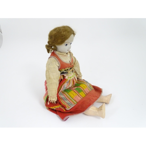 903 - Toy: A 20thC French doll with bisque head, glass eyes, painted features and a composite body with ar... 