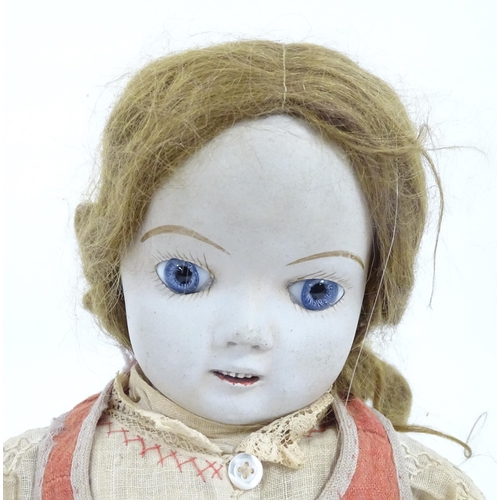 903 - Toy: A 20thC French doll with bisque head, glass eyes, painted features and a composite body with ar... 