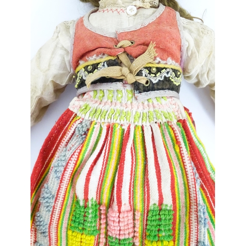 903 - Toy: A 20thC French doll with bisque head, glass eyes, painted features and a composite body with ar... 