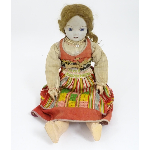 903 - Toy: A 20thC French doll with bisque head, glass eyes, painted features and a composite body with ar... 