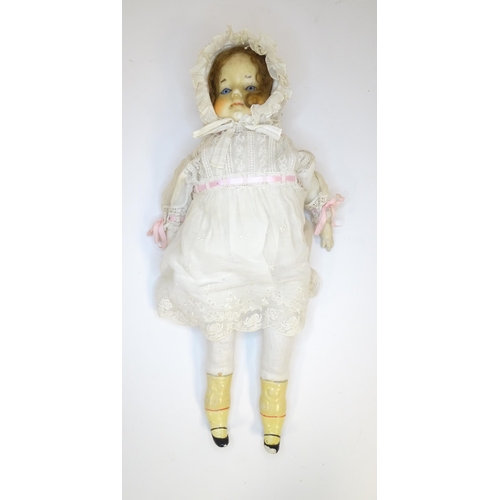 904 - Toy: A 20thC doll with wax head, glass eyes, painted features, composite arms and lower legs. Approx... 