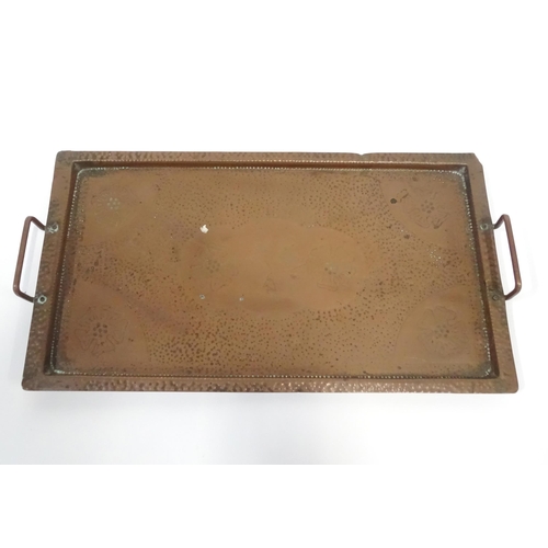 120 - A 20thC copper tray of rectangular form with twin handles and hammered decoration. Approx. 20 1/4