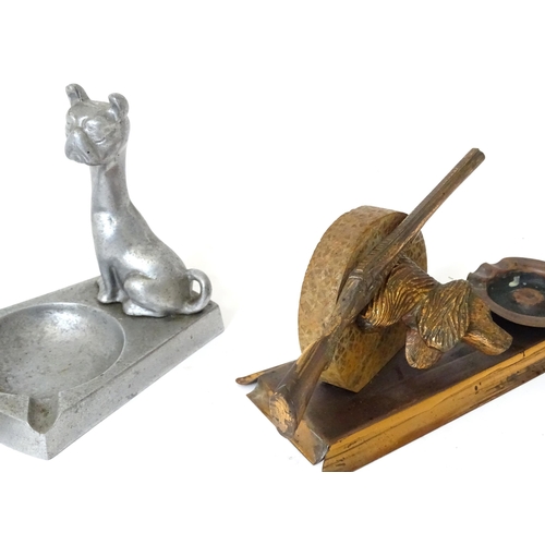 121 - A quantity of assorted 20thC novelty ashtrays to include one with shotgun and dog head detail, one w... 