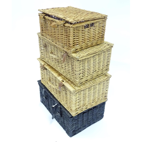 178 - Four wicker baskets / hampers to include examples by Fortnum & Mason, Harvey Nichols etc. Largest ap... 