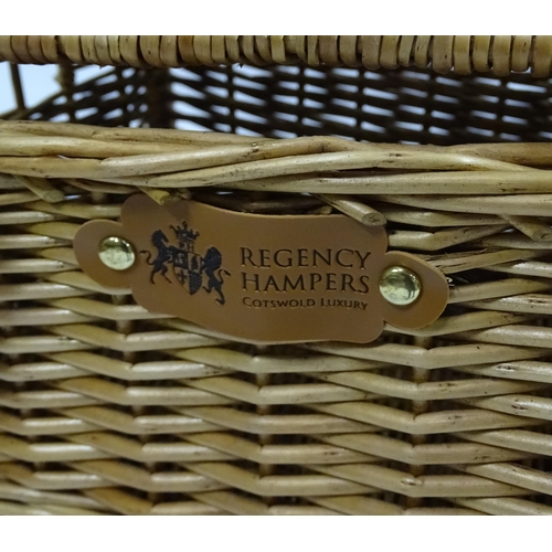 178 - Four wicker baskets / hampers to include examples by Fortnum & Mason, Harvey Nichols etc. Largest ap... 