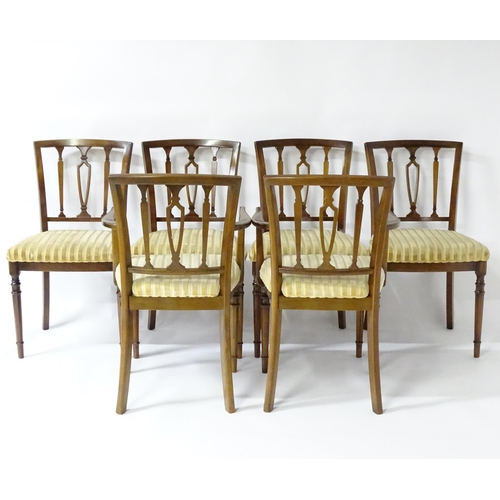 190 - A set of eight modern dining chairs with pierced back splats and raised on canted tapering front leg... 