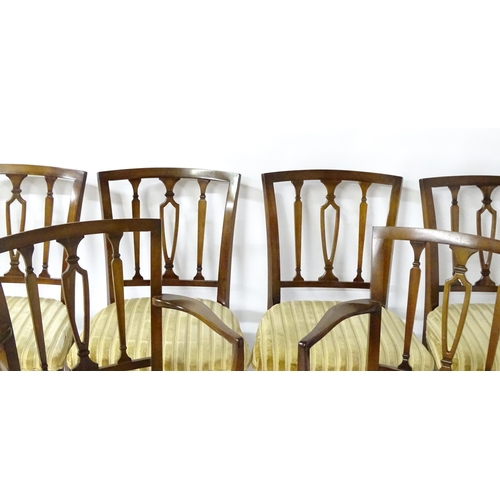 190 - A set of eight modern dining chairs with pierced back splats and raised on canted tapering front leg... 