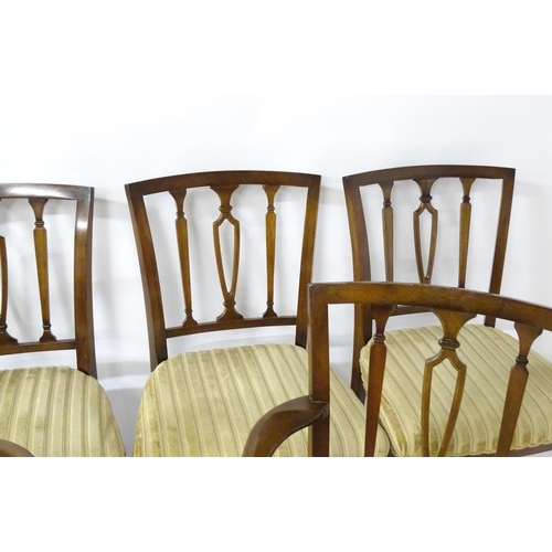 190 - A set of eight modern dining chairs with pierced back splats and raised on canted tapering front leg... 