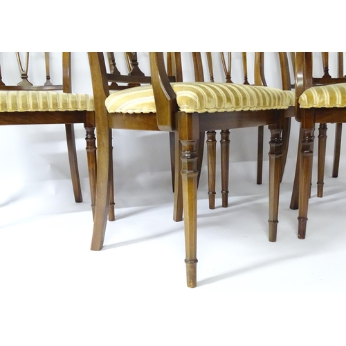 190 - A set of eight modern dining chairs with pierced back splats and raised on canted tapering front leg... 