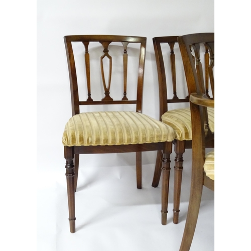 190 - A set of eight modern dining chairs with pierced back splats and raised on canted tapering front leg... 