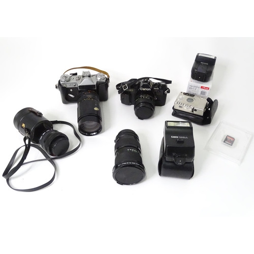 262 - A quantity of cameras and camera / photograph equipment to include a Canon AE-1, a Zenit E with Opto... 