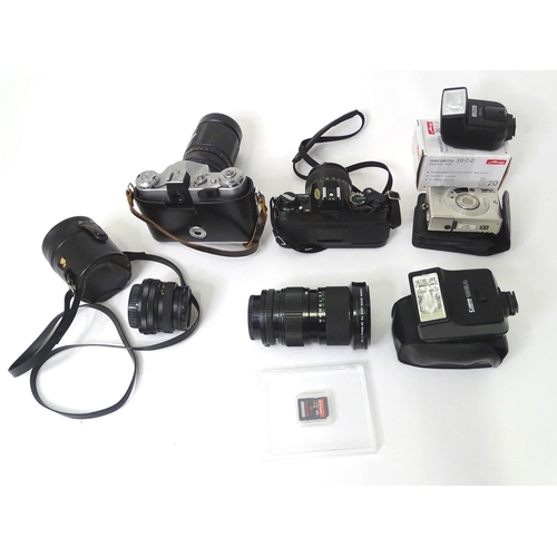 262 - A quantity of cameras and camera / photograph equipment to include a Canon AE-1, a Zenit E with Opto... 