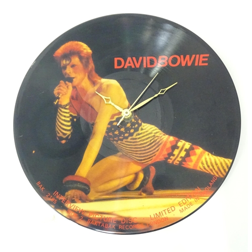 279 - Two wall clocks converted from picture disk LPs / vinyl records, comprising titles by David Bowie an... 