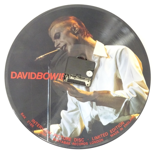 279 - Two wall clocks converted from picture disk LPs / vinyl records, comprising titles by David Bowie an... 