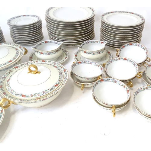 283 - A quantity of Haviland Limoges dinner wares with banded foliate border, to include plates, serving p... 