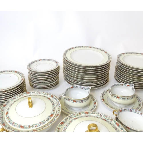 283 - A quantity of Haviland Limoges dinner wares with banded foliate border, to include plates, serving p... 