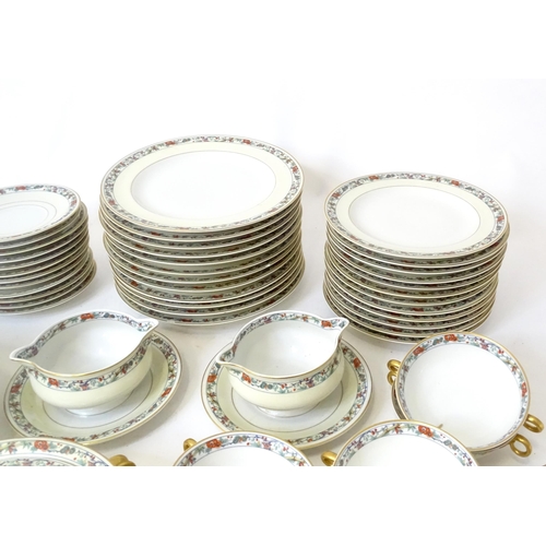 283 - A quantity of Haviland Limoges dinner wares with banded foliate border, to include plates, serving p... 