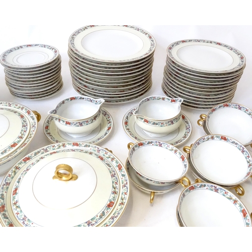 283 - A quantity of Haviland Limoges dinner wares with banded foliate border, to include plates, serving p... 