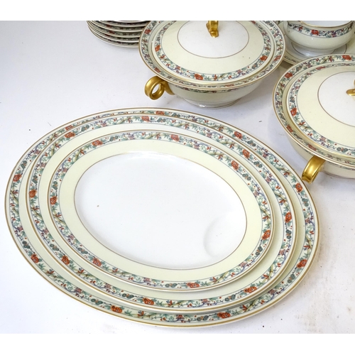 283 - A quantity of Haviland Limoges dinner wares with banded foliate border, to include plates, serving p... 