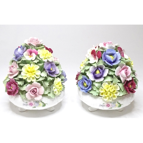 290 - A pair of Aynsley table centrepieces with encrusted flower detail. Approx. 6 1/2