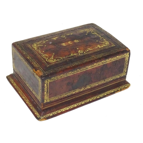 300 - An Italian leather covered and tooled cigarette box, opening to reveal a fitted interior. Box marked... 