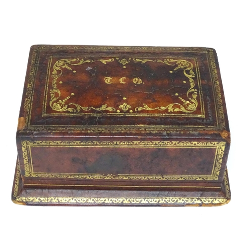 300 - An Italian leather covered and tooled cigarette box, opening to reveal a fitted interior. Box marked... 