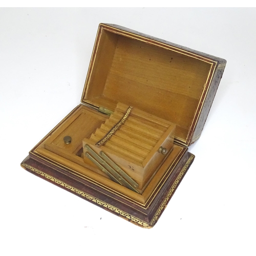 300 - An Italian leather covered and tooled cigarette box, opening to reveal a fitted interior. Box marked... 