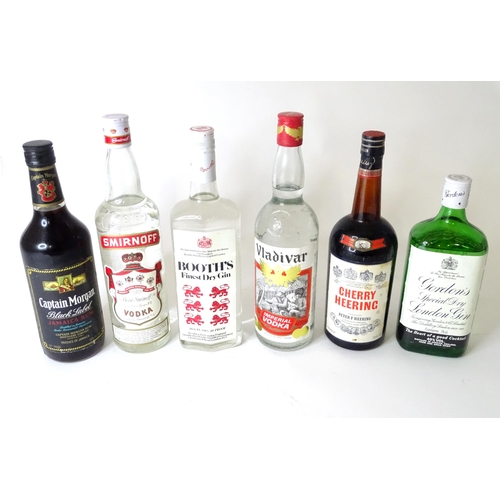 307 - Six bottles of spirits to include Captain Morgan rum, Booth's Gin, Smirnoff Vodka, Cherry Heering, e... 