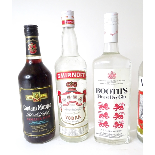 307 - Six bottles of spirits to include Captain Morgan rum, Booth's Gin, Smirnoff Vodka, Cherry Heering, e... 