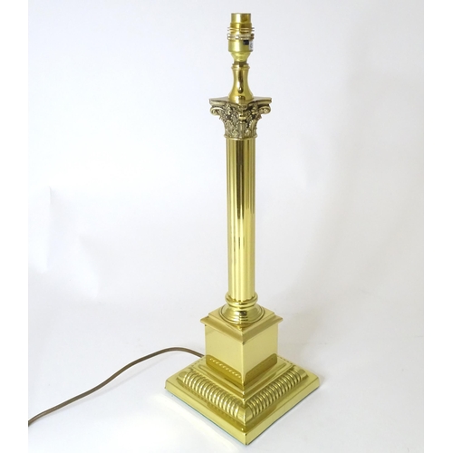 308 - A table lamp of Corinthian column form. Approx. 21 1/2