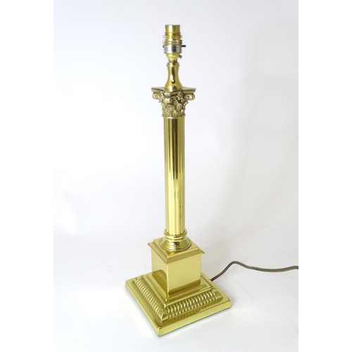 308 - A table lamp of Corinthian column form. Approx. 21 1/2