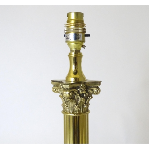 308 - A table lamp of Corinthian column form. Approx. 21 1/2