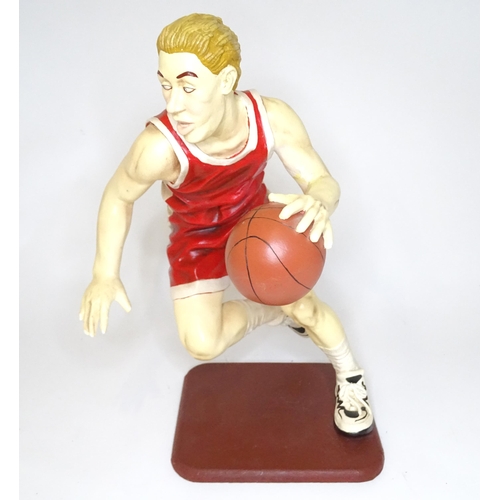 313 - A model of a basketball player with cast signature for Jun Asilo 97. Approx. 17 1/2