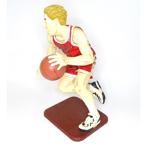 313 - A model of a basketball player with cast signature for Jun Asilo 97. Approx. 17 1/2