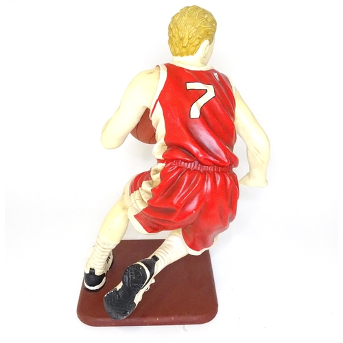 313 - A model of a basketball player with cast signature for Jun Asilo 97. Approx. 17 1/2