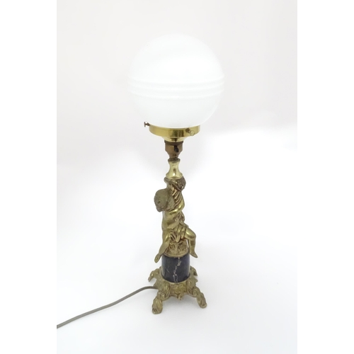 334 - A 20thC cast table lamp with cherub detail to column. Approx. 18 1/2