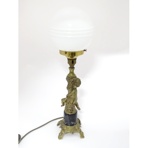 334 - A 20thC cast table lamp with cherub detail to column. Approx. 18 1/2