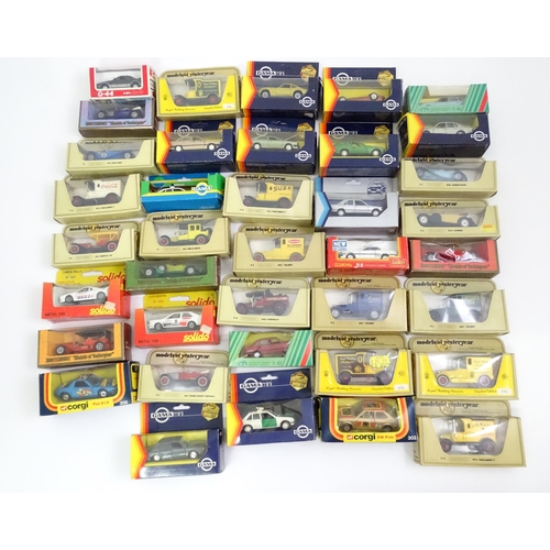 338 - Toys: A quantity of assorted die cast scale model cars / vehicles to include Corgi Toys VW Polo, Fia... 