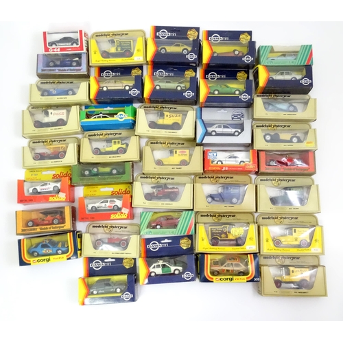 338 - Toys: A quantity of assorted die cast scale model cars / vehicles to include Corgi Toys VW Polo, Fia... 