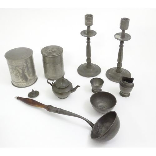 346 - A quantity of pewter items to include a pair of candlesticks, ladle, pot and cover, teapot of small ... 