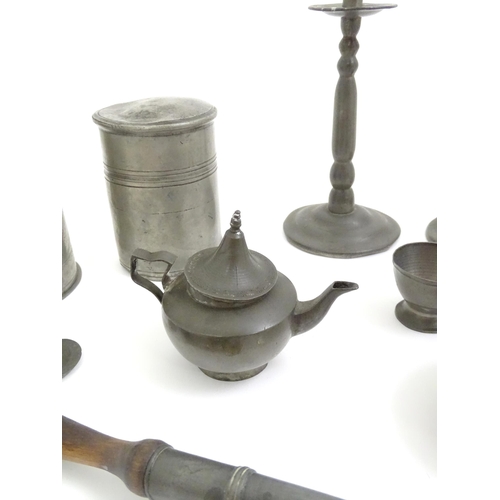 346 - A quantity of pewter items to include a pair of candlesticks, ladle, pot and cover, teapot of small ... 