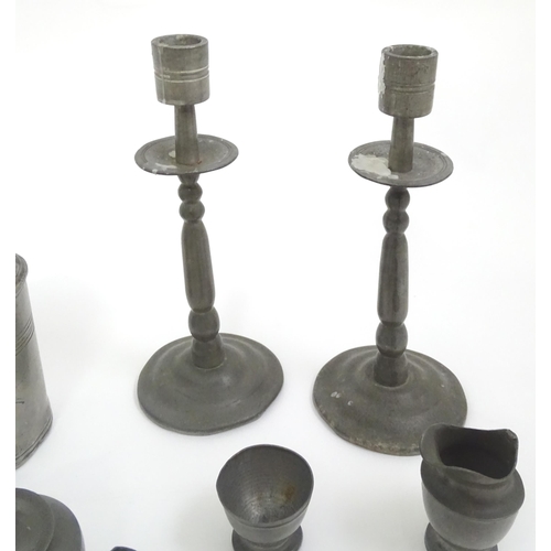 346 - A quantity of pewter items to include a pair of candlesticks, ladle, pot and cover, teapot of small ... 