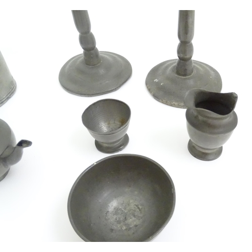 346 - A quantity of pewter items to include a pair of candlesticks, ladle, pot and cover, teapot of small ... 