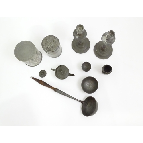 346 - A quantity of pewter items to include a pair of candlesticks, ladle, pot and cover, teapot of small ... 