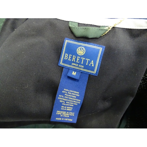 356 - Country clothing : a Beretta skeet vest / clay shooting waistcoat in black/green with silver piping,... 