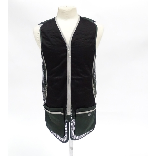 356 - Country clothing : a Beretta skeet vest / clay shooting waistcoat in black/green with silver piping,... 