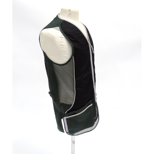 356 - Country clothing : a Beretta skeet vest / clay shooting waistcoat in black/green with silver piping,... 