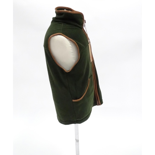 357 - Country clothing : a Shooterking Performance fleece gilet / waistcoat, in olive green with faux leat... 