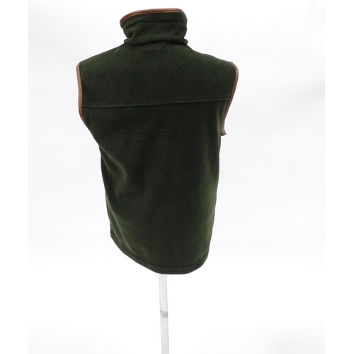 357 - Country clothing : a Shooterking Performance fleece gilet / waistcoat, in olive green with faux leat... 